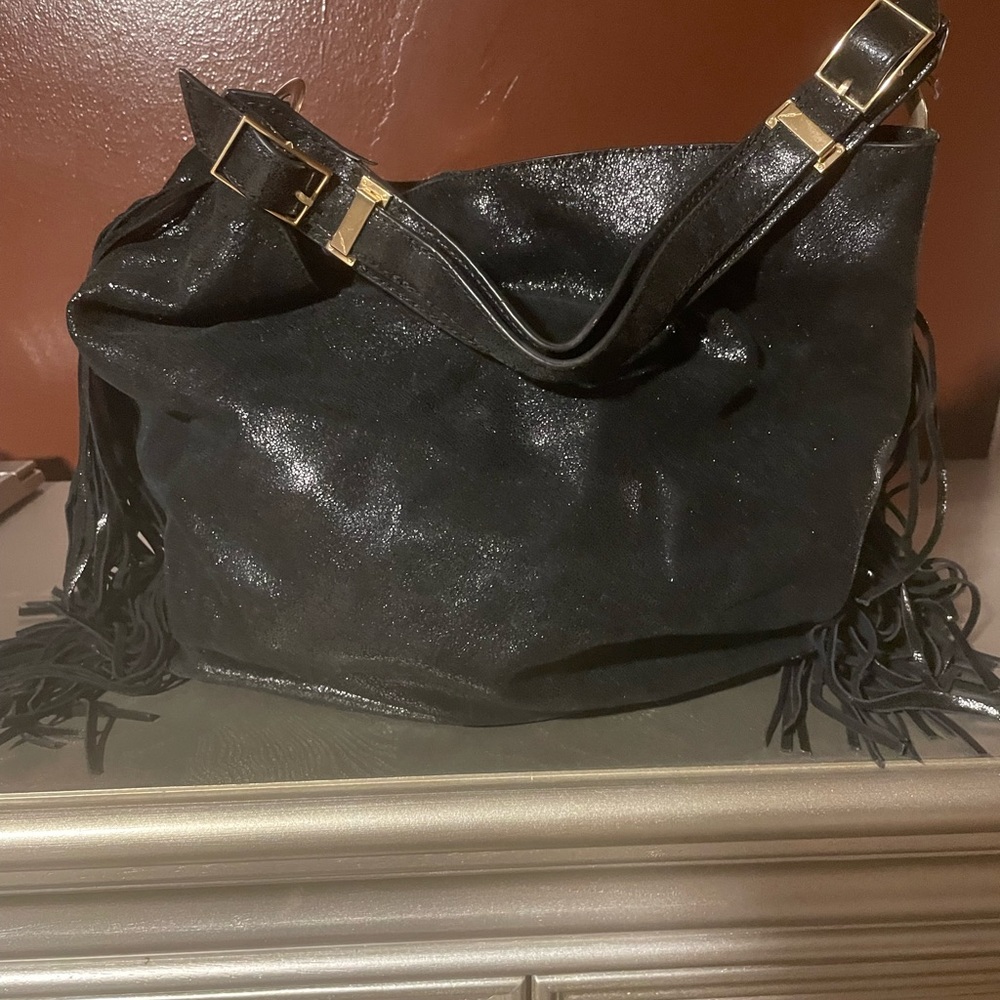 Metallic black, Brian Atwood, gently used medium size fringed hobo bag.